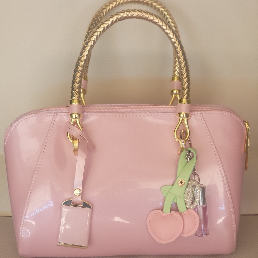 Elegant Pink Handbag with Gold Accents - Picture 4 of 7